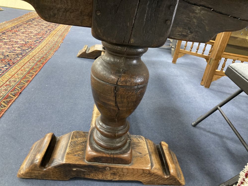 An oak refectory table on turned end supports, width 222cm depth 84cm height 77cm